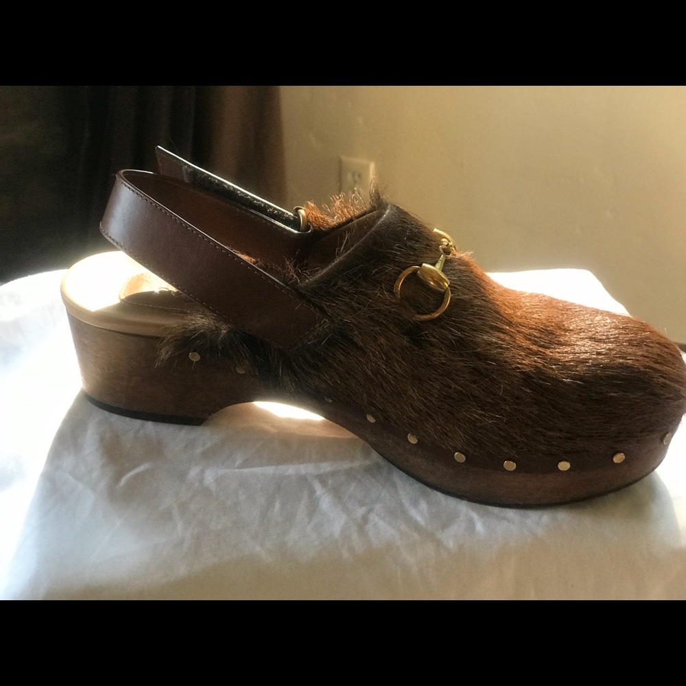 Gucci pony hair gold tone clogs